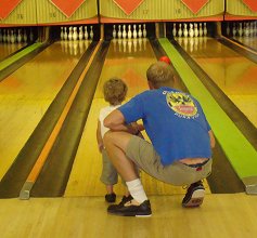 Jackson bowling with Dallas helping